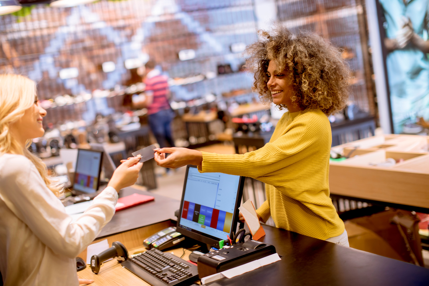 customer experience moment in premium wellness or beauty retail store, staff member advising customer on product, friendly professional candid style