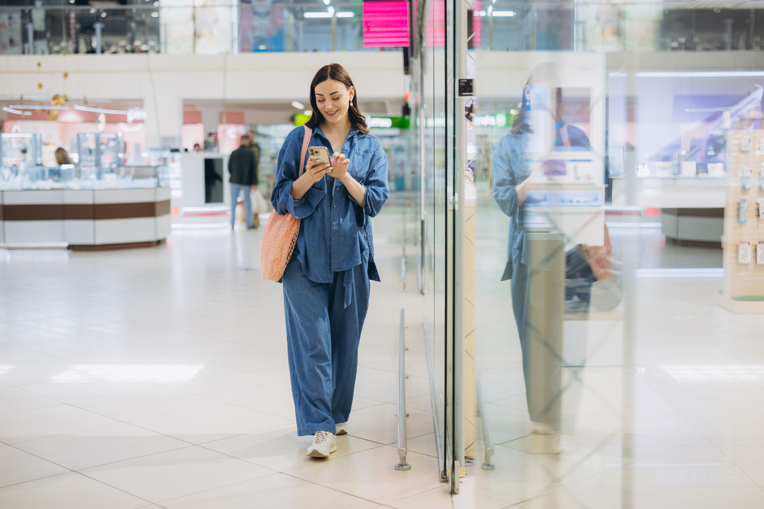 retail loss prevention manager reviewing store security on tablet in busy shopping centre retail environment, discreet professional security, bright modern style