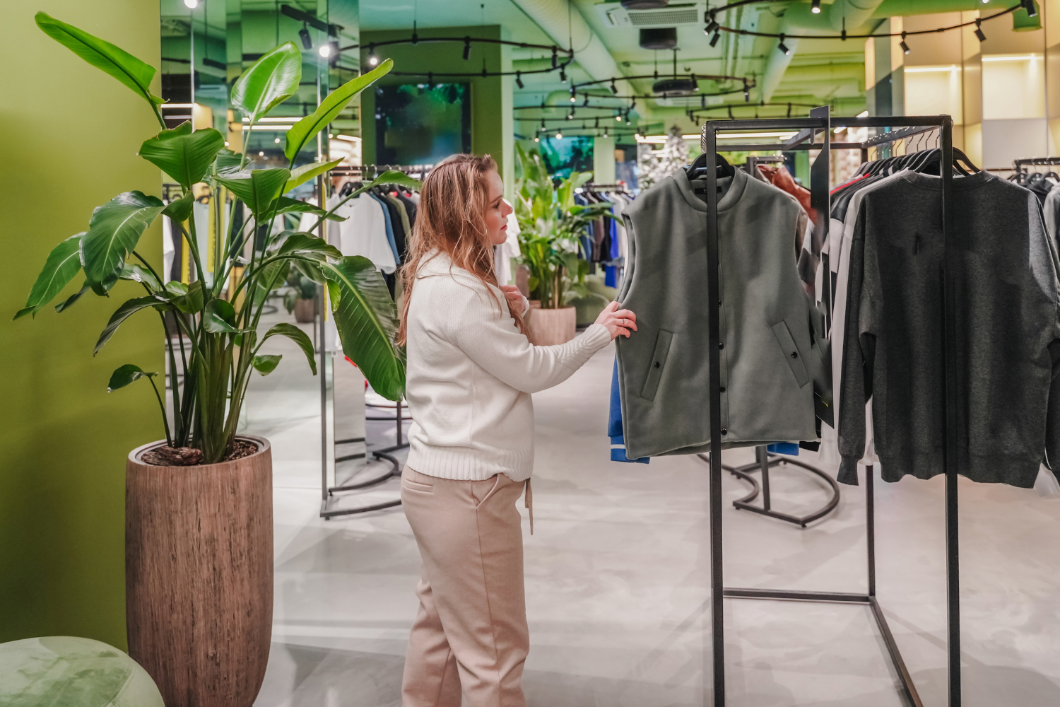 woman shopping for clothes in retail store